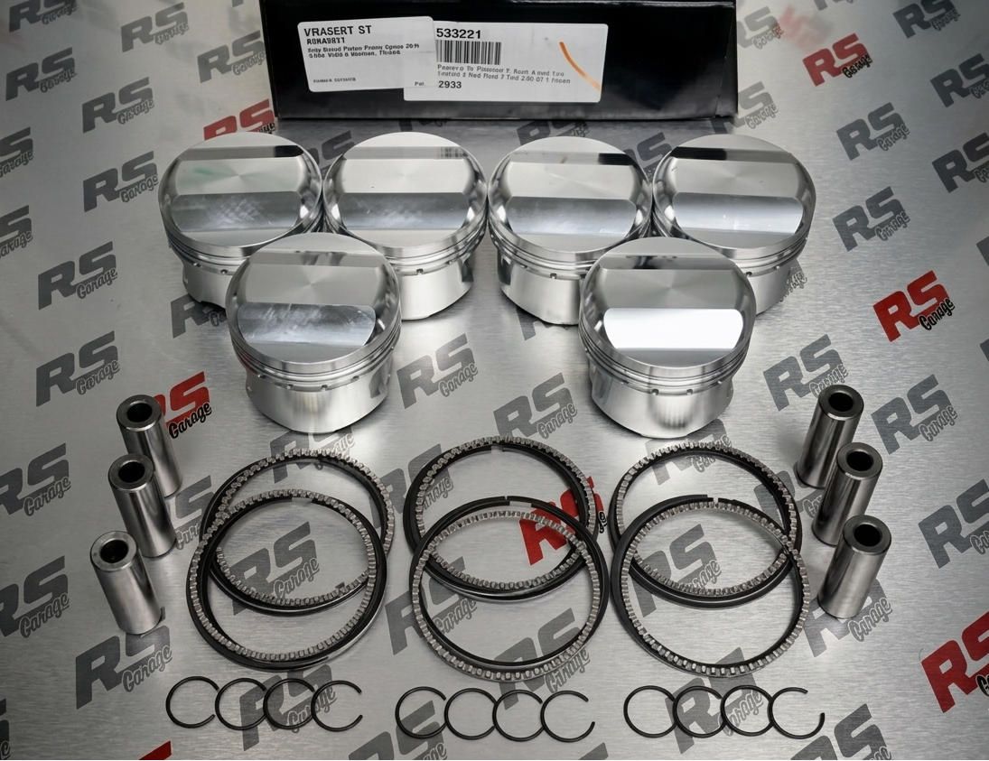 Set of polished engine pistons and rings on a branded background