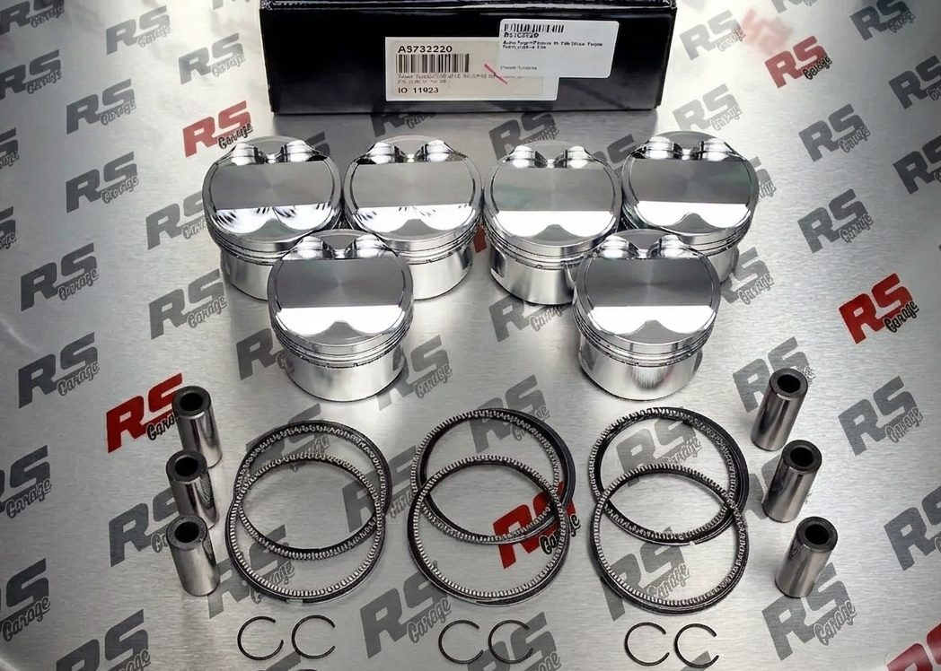 Engine piston set with rings and pins on a branded RS background