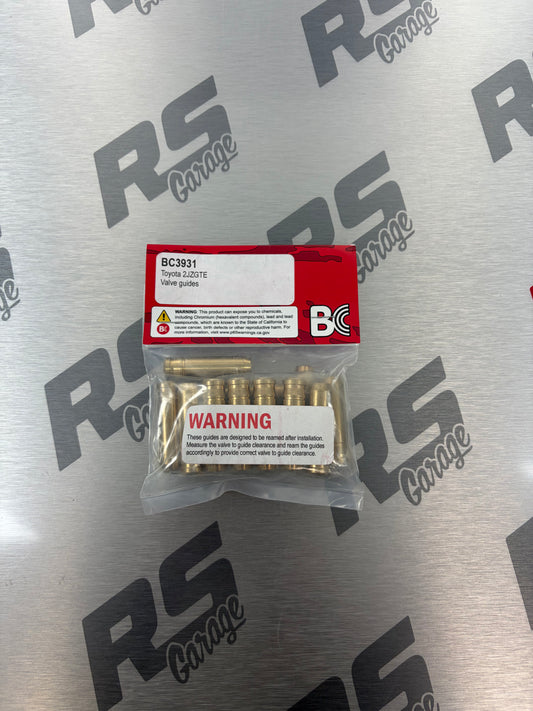 Packaged automotive parts on a metallic surface with 'RS Garage' branding.