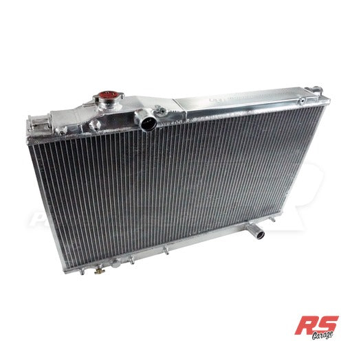 PHR XTM Aluminum Race Radiator -Polished finish -OEM hose inlet and outlet - Polished finish will only be on the top ta - Polished, OEM hose inlet and outlet, No Transmission Cooler
